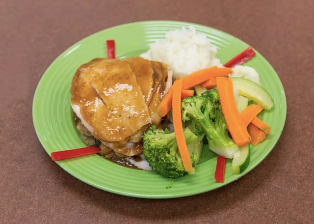 Fresh Turkey with Stuffing, Mashed Potatoes, Gravy, Vegetable and Cranberry Sauce - Lunch Special.