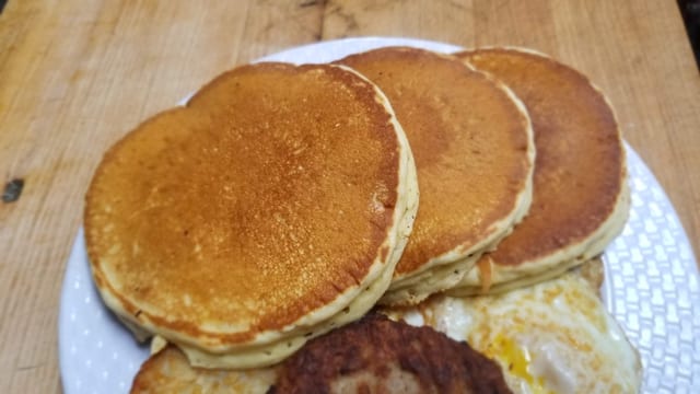 Pancakes with Sausage Home Fries and a Drink.