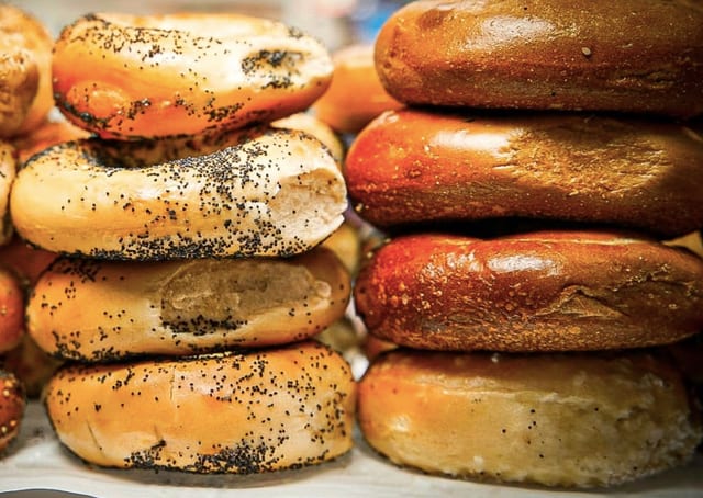 Dozen Bagels sliced in a bag.
